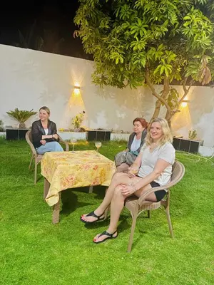 a group of women sitting in chairs around a table at Paradise House Holiday in Luxor