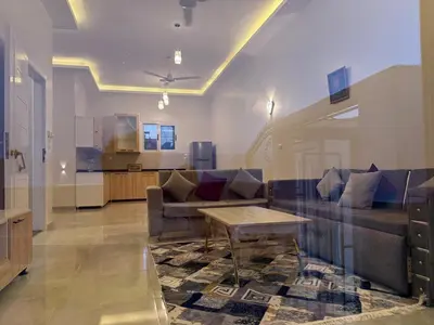 a living room with a couch and a table at Nefertarie Villa in Luxor