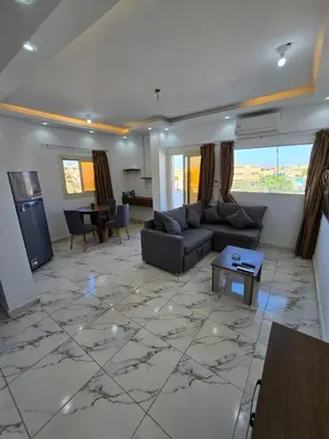 a living room with a large marble floor at الغردقة in Hurghada