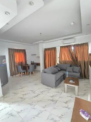 a living room with a couch and a table at الغردقة in Hurghada