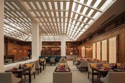 a rendering of a restaurant with tables and chairs at Al Kasr Sahl Hasheesh - Ultra All-Inclusive in Hurghada