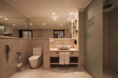 a bathroom with a sink and a toilet at Al Kasr Sahl Hasheesh - Ultra All-Inclusive in Hurghada