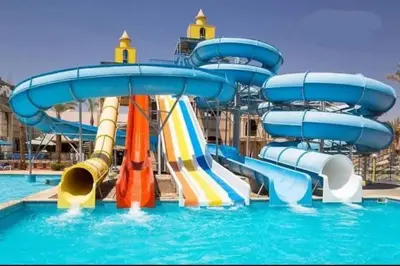 a water park with a water slide in the water at Veronia gad chalet Mirage bay aqua park in Hurghada