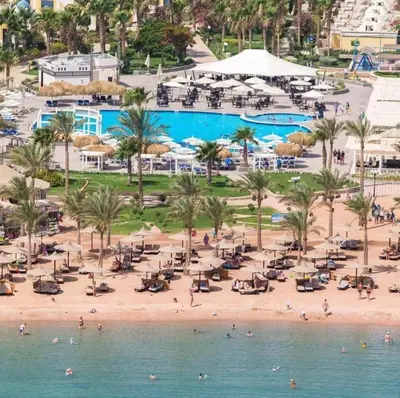 an aerial view of a beach with a pool at Veronia gad chalet Mirage bay aqua park in Hurghada