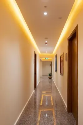 a corridor of a hospital with yellow ceilings at Elyasmene in Qena