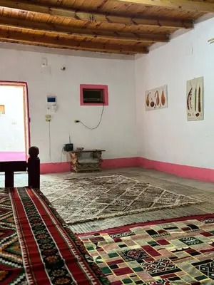 an empty room with a rug on the floor at Mountain guest house in Luxor