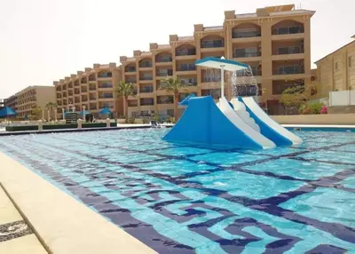 a slide in the pool at a resort at One bedroom and reception Selena bay, Hurghada in Hurghada