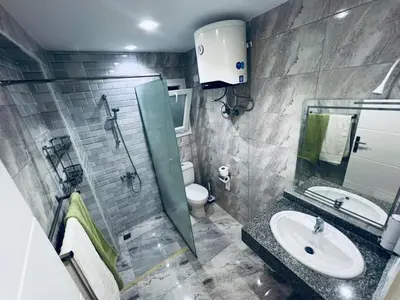 a bathroom with a sink and a shower and a toilet at One bedroom and reception Selena bay, Hurghada in Hurghada