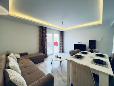 a living room with a couch and a table at One bedroom and reception Selena bay, Hurghada in Hurghada