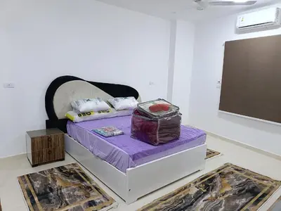 a bed in a room with a purple mattress at شقة كاملة بغرفتي نوم دور ارضي in Hurghada