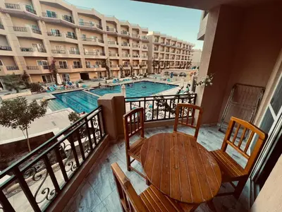 a balcony of a hotel with a swimming pool at Selena Bay in Hurghada