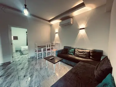 a living room with a couch and a table at Selena Bay in Hurghada