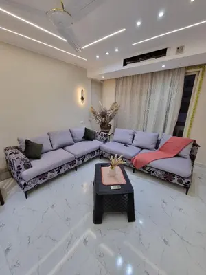 a living room with two couches and a coffee table at شقه على البحر مباشره in Hurghada