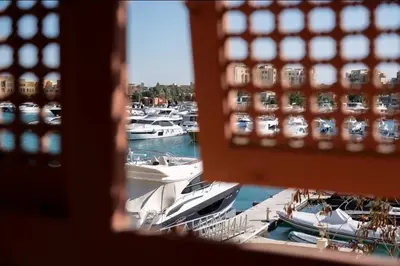 a view from a window of boats in a marina at Luxury Stays in New Marina El Gouna in Hurghada