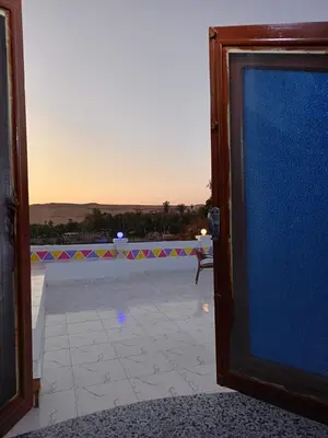 an open door with a view of a patio at Reagan House in Aswan