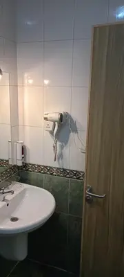 a bathroom with a sink and a toilet at S S Luxor Hotel in Luxor