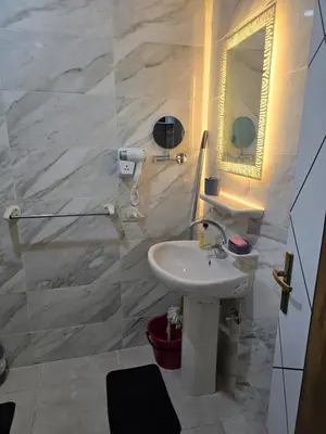 a bathroom with a sink and a mirror at Golden Tiba in Hurghada