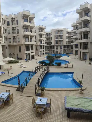 a large apartment complex with a large swimming pool at Apartmant for family in Hurghada in Hurghada