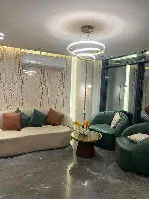 a living room with a couch and two chairs and a table at طيبة جولد Tiba Gold in Hurghada