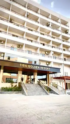a building with a sign that reads tia golden resort at طيبة جولد Tiba Gold in Hurghada