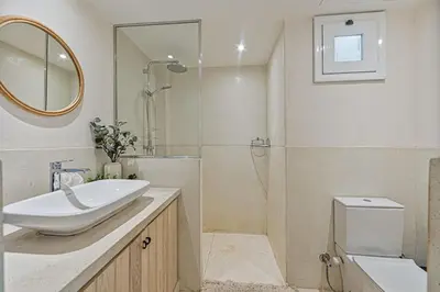 a bathroom with a sink and a shower and a toilet at Peaceful Oasis, Stunning Views and Refreshing Pool, El Gouna in Hurghada
