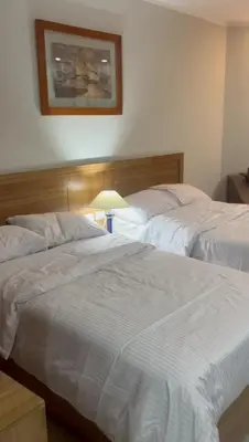 two beds sitting next to each other in a bedroom at Scandic resort in Hurghada