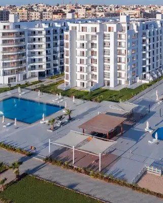 an aerial view of a large apartment complex with a swimming pool at Scandic resort in Hurghada