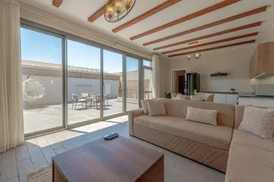 a living room with a couch and a table at Lovely 2BR with Private Pool in Bali El Gouna in Hurghada