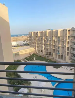 a view from a balcony of a apartment building at Princess Resort hurghada in Hurghada