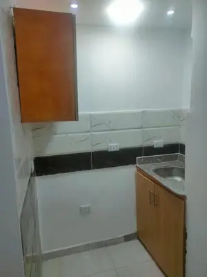 a small kitchen with a sink and a cabinet at كمبوند كابتن in Hurghada