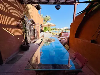 a swimming pool in the middle of a building at El Gouna Nubian Lagoonfront Villa - 4BR, 9 Guests in El Gouna