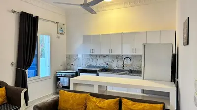a kitchen with a large white counter in a room at Villa Hofni in Luxor