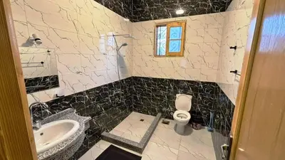 a bathroom with a sink and a toilet in it at Villa Hofni in Luxor