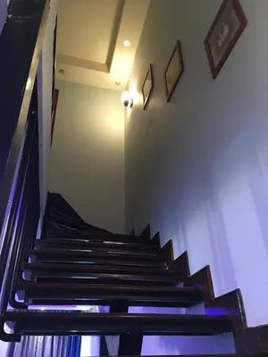 a set of stairs in a room with a light at The view in Hurghada