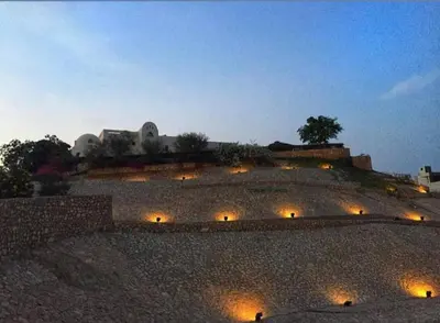 a building with lights on top of it at night at The view in Hurghada