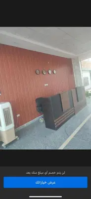 a picture of a building with a bench in front of it at منتجع اوسيس مارينا in Hurghada