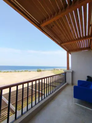 a balcony with a view of the beach at Bay breeze in Hurghada
