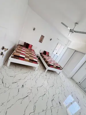 a white room with a bed and a window at Muhammad Ali house in Luxor