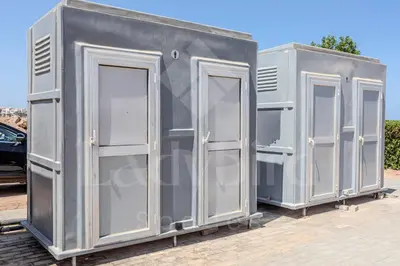 a couple of gray portable toilets sitting next to each other at Ladybird - Veranda Loft in Hurghada