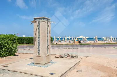 a stone pillar in the middle of a beach at Ladybird - Veranda Loft in Hurghada