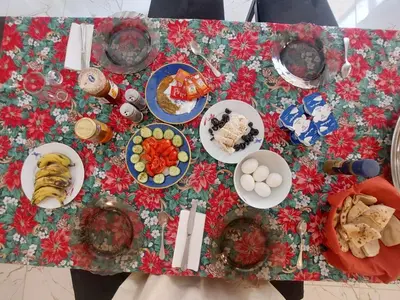 a table with plates of food on top of it at Carter Guesthouse Luxor 5 in ‘Ezbet Abu Ḥabashi