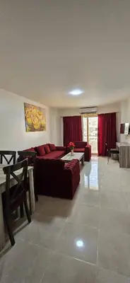 a living room with a couch and a table at Tiba golden resort hurghada holiday in Hurghada