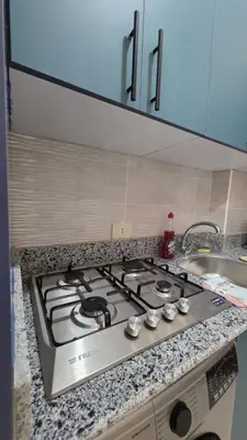 a stove top in a kitchen next to a sink at Tiba golden resort hurghada holiday in Hurghada