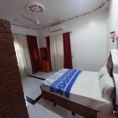 a bedroom with a bed in a room at Villa Nicole in Luxor