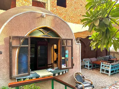 an outside view of a building with a dome at El Fayrouz Guesthouse Luxor in Luxor