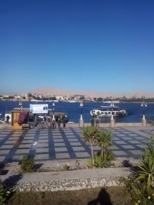 a view of a large body of water with a boat at Elbess For Toursim in Luxor