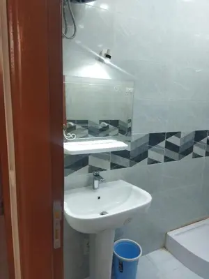 a bathroom with a sink and a mirror at Hurghada city apartments 5 in Hurghada