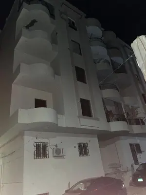 a building with a car parked in front of it at Hurghada city apartments 5 in Hurghada