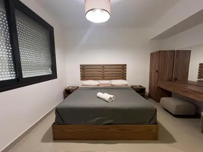 a bedroom with a bed with a towel on it at Modern Studio in G-Cribs El Gouna in Hurghada