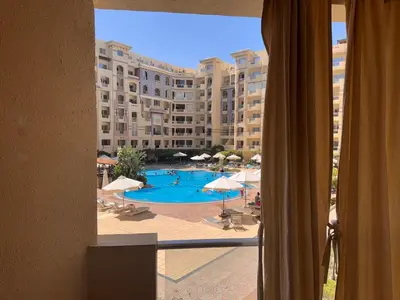 a view of a pool from a hotel room window at Modern 1bedroom in Hurghada in Hurghada